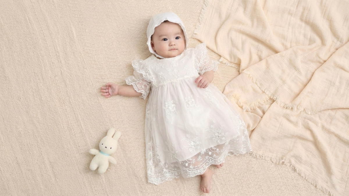 Close-up of delicate lace detailing on a Japanese-made baby ceremony dress
