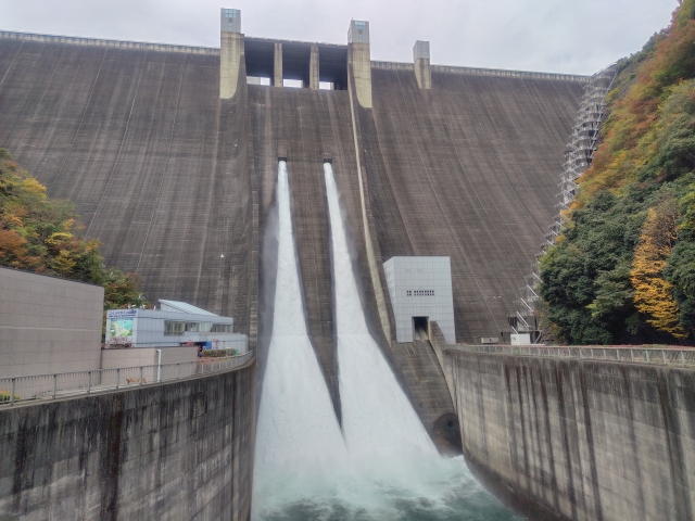 The spectacular tourist water discharge at Miyagase Dam, water surging out at an overwhelming scale