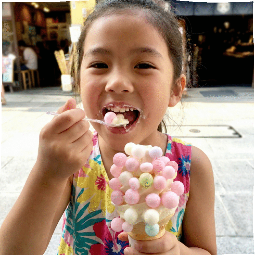 A girl eating an Oiri soft-serve ice cream