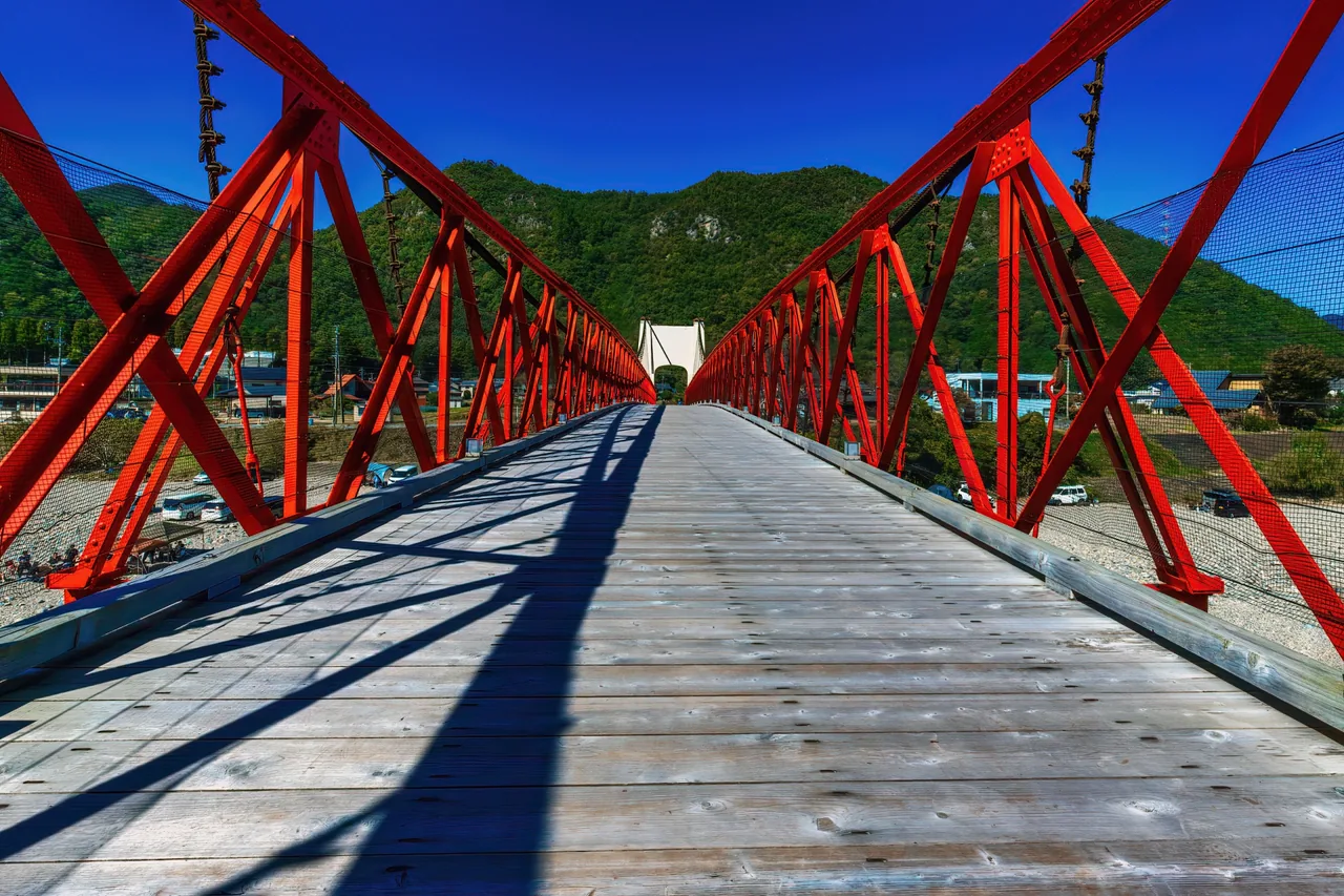 Mino Bridge — Japan's oldest surviving modern suspension bridge — with its beautiful red iron span over the Nagara River