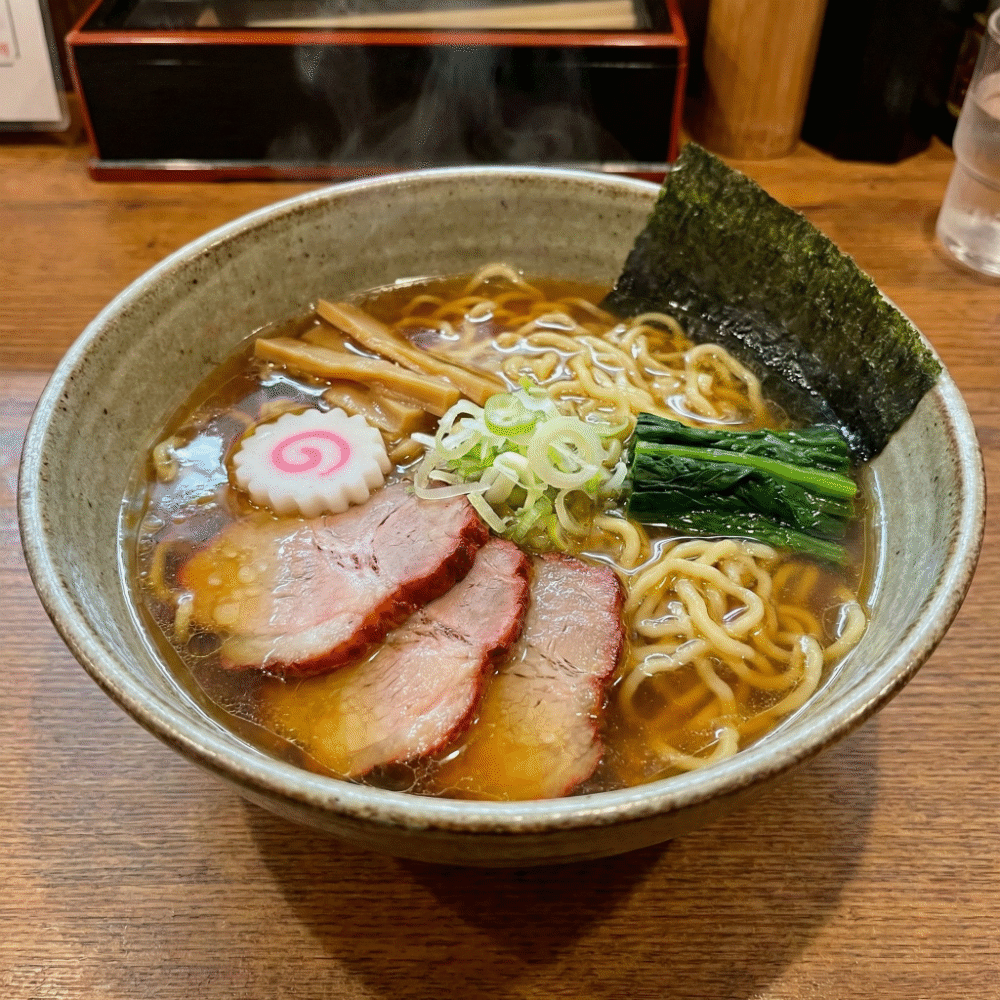 A mouth-watering bowl of Shirakawa Ramen with soy sauce broth and wavy noodles