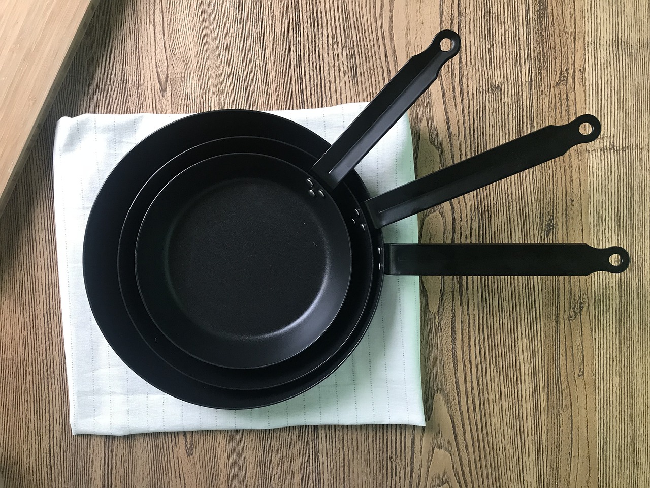 Japanese iron frying pan hanging to dry after washing — showing proper care routine for long-lasting Japanese cookware