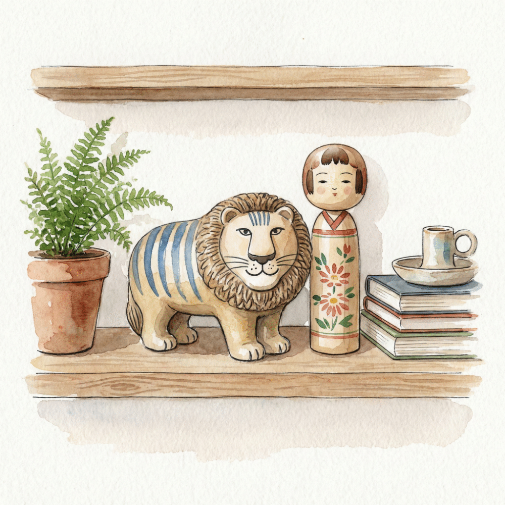 Illustration of a modern shelf with Japanese kokeshi and aka-beko arranged alongside Lisa Larson figurines